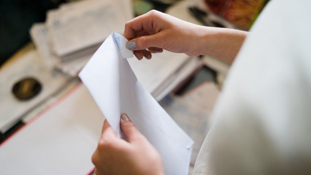 a person opens mail