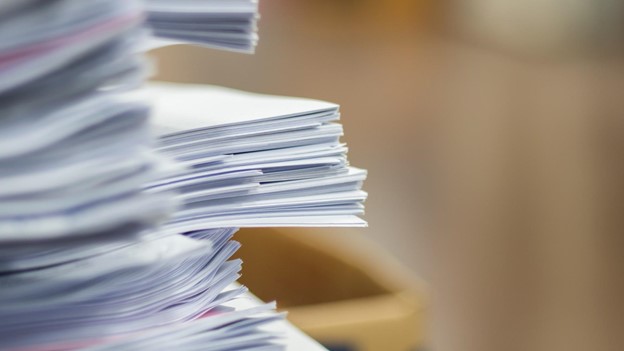 a stack of documents on the table
