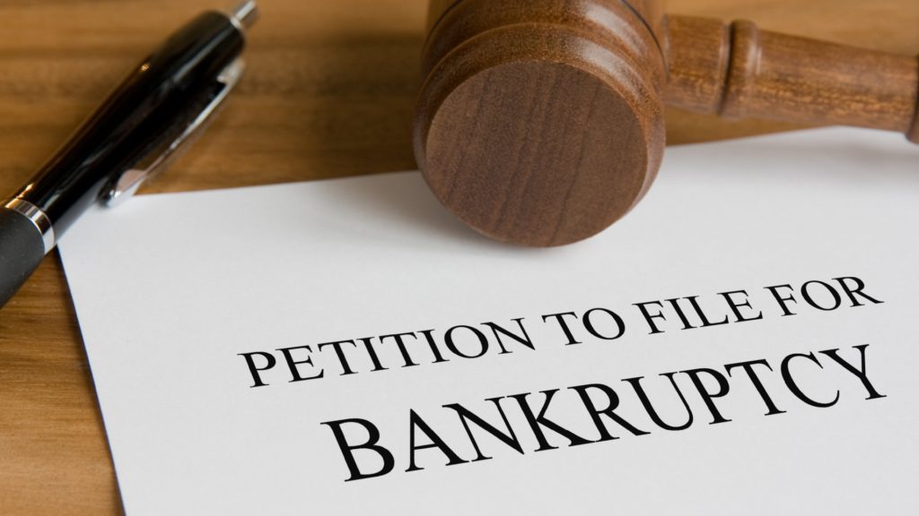 a gavel and a pen petition to file for bankruptcy