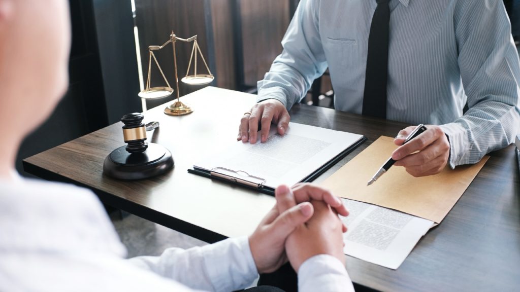 a lawyer speaks to a client about how a Texas bankruptcy attorney can help