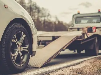 Car on a tow truck being repossessed | Texas bankruptcy lawyers