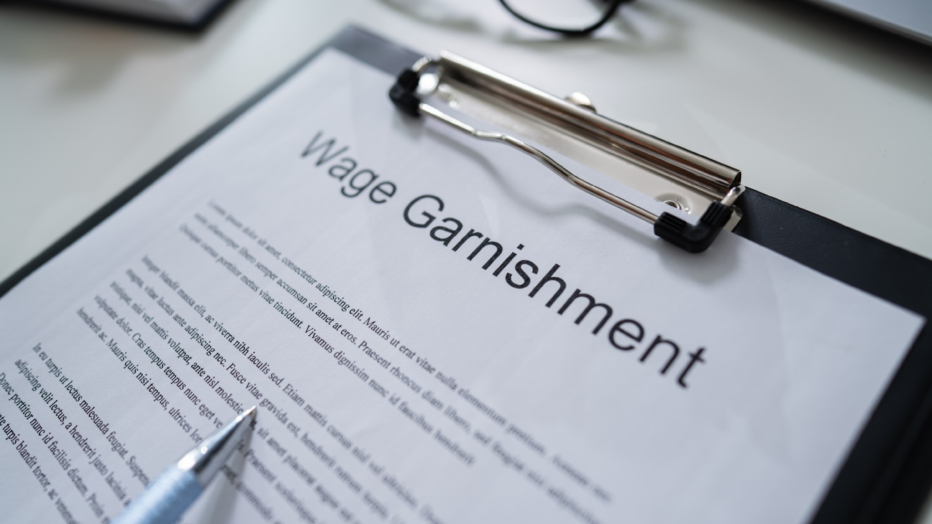 wage garnishment documents sit on a desk