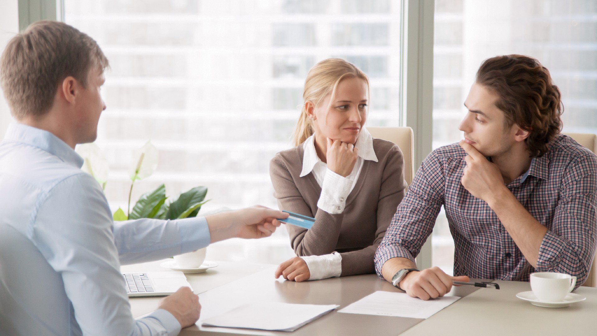 A couple talks to a credit counselor