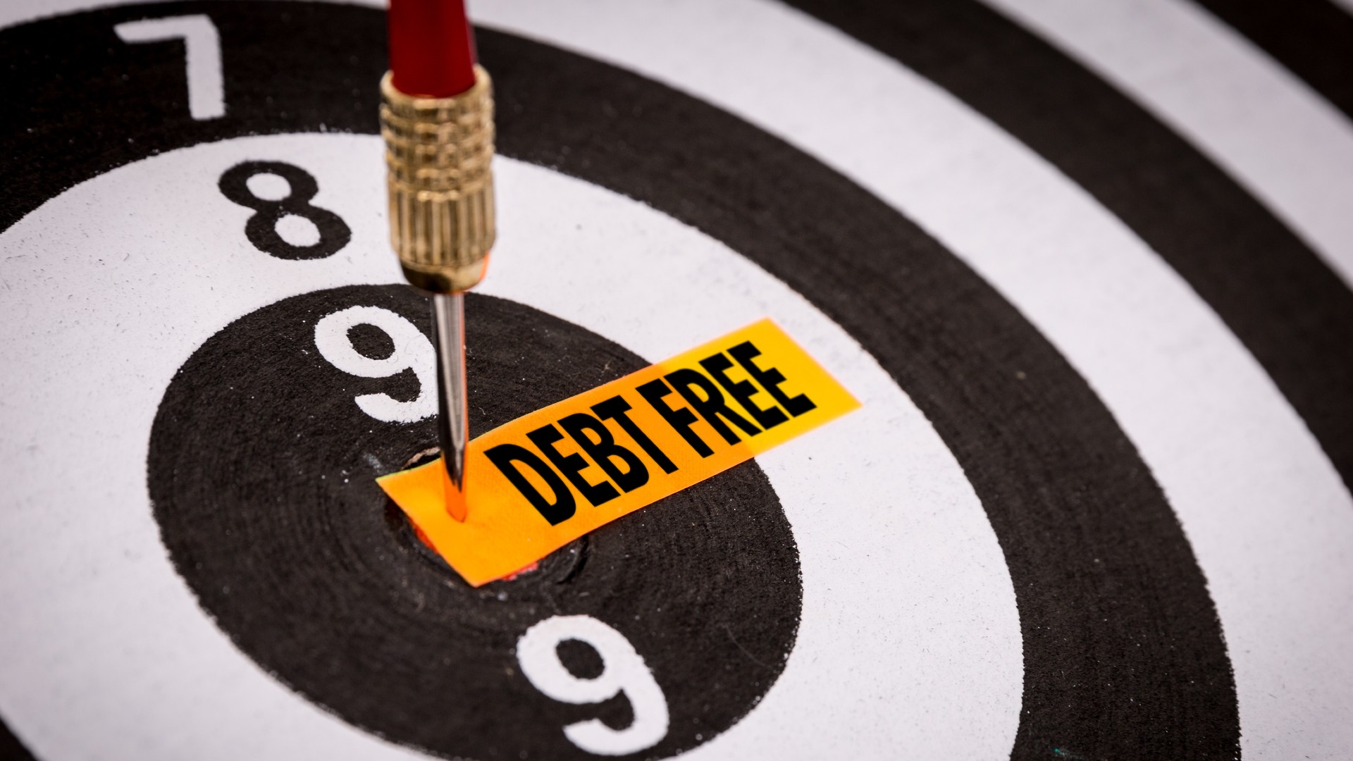 The words “debt free” are on a bullseye