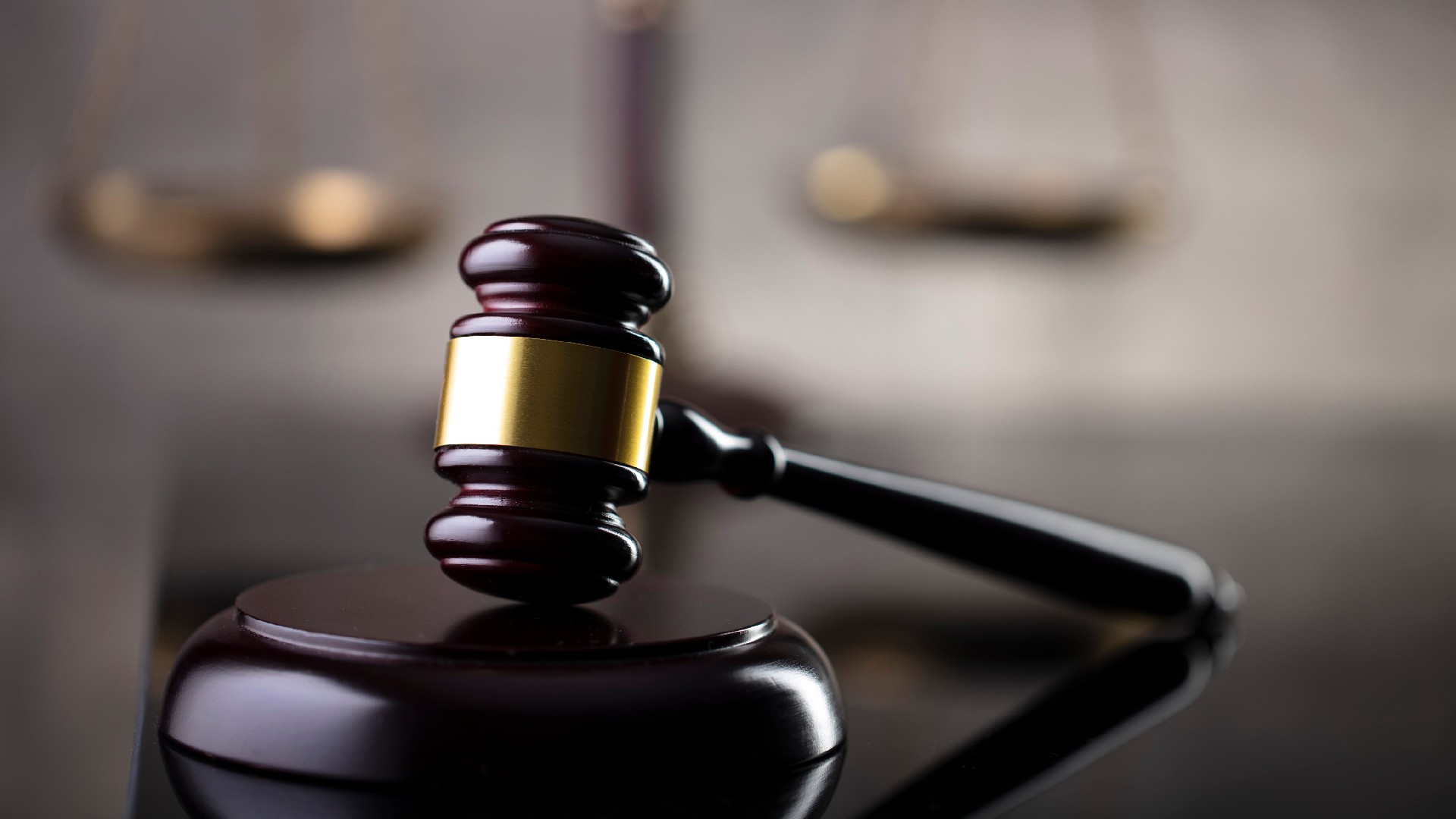 A gavel sits against a blurred background