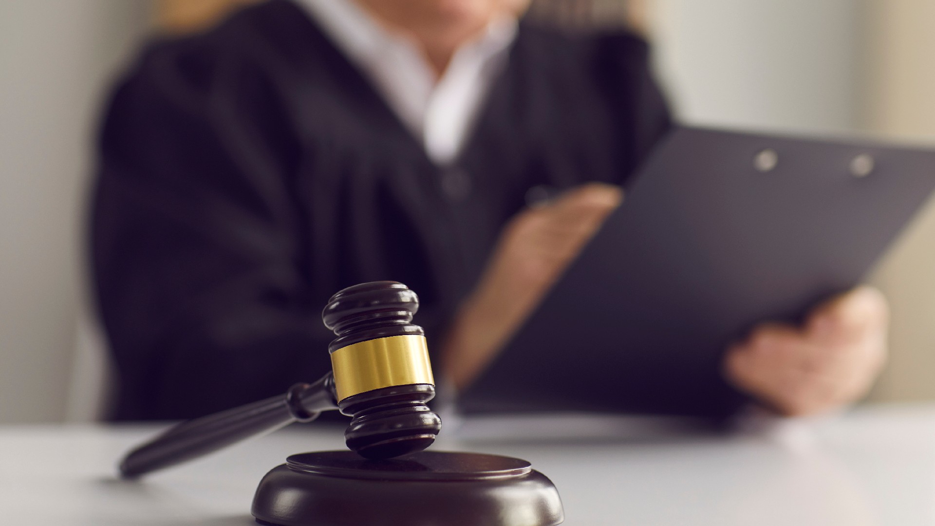 A gavel sits in front of a judge