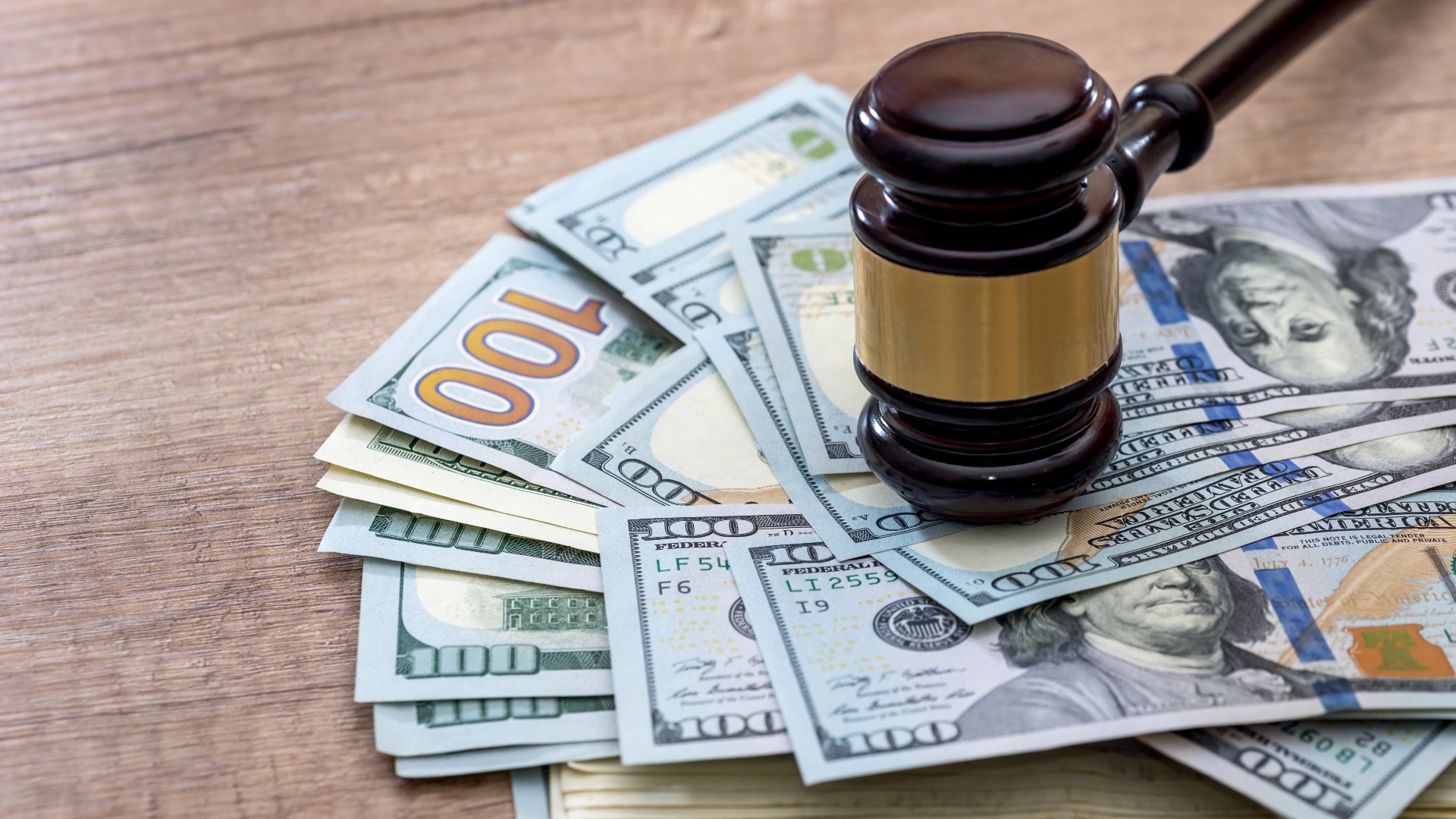 A gavel sits on top of money