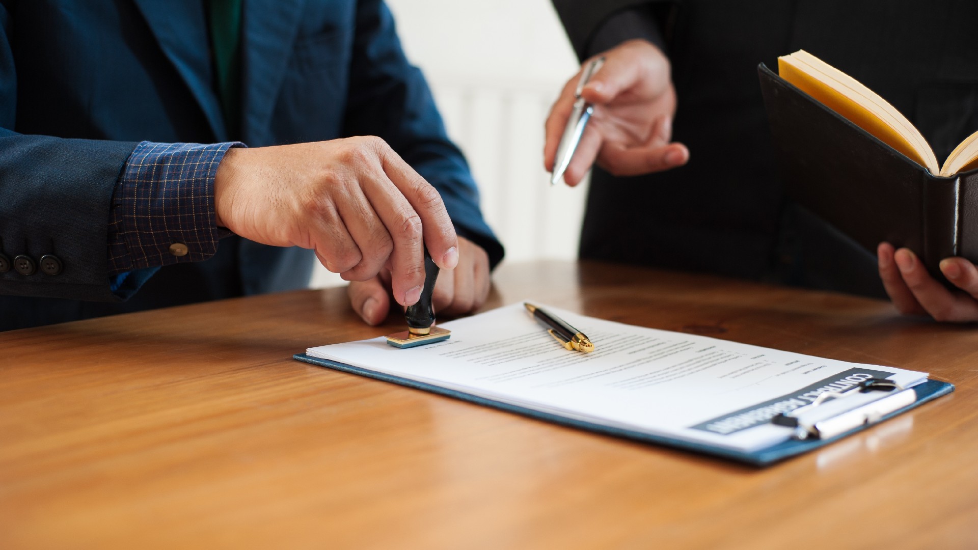 A lawyer reviews a document with a client