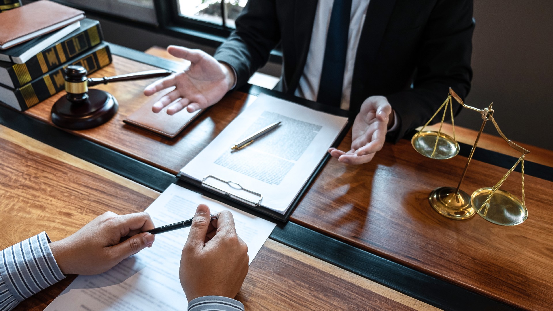 A lawyer speaks to a client