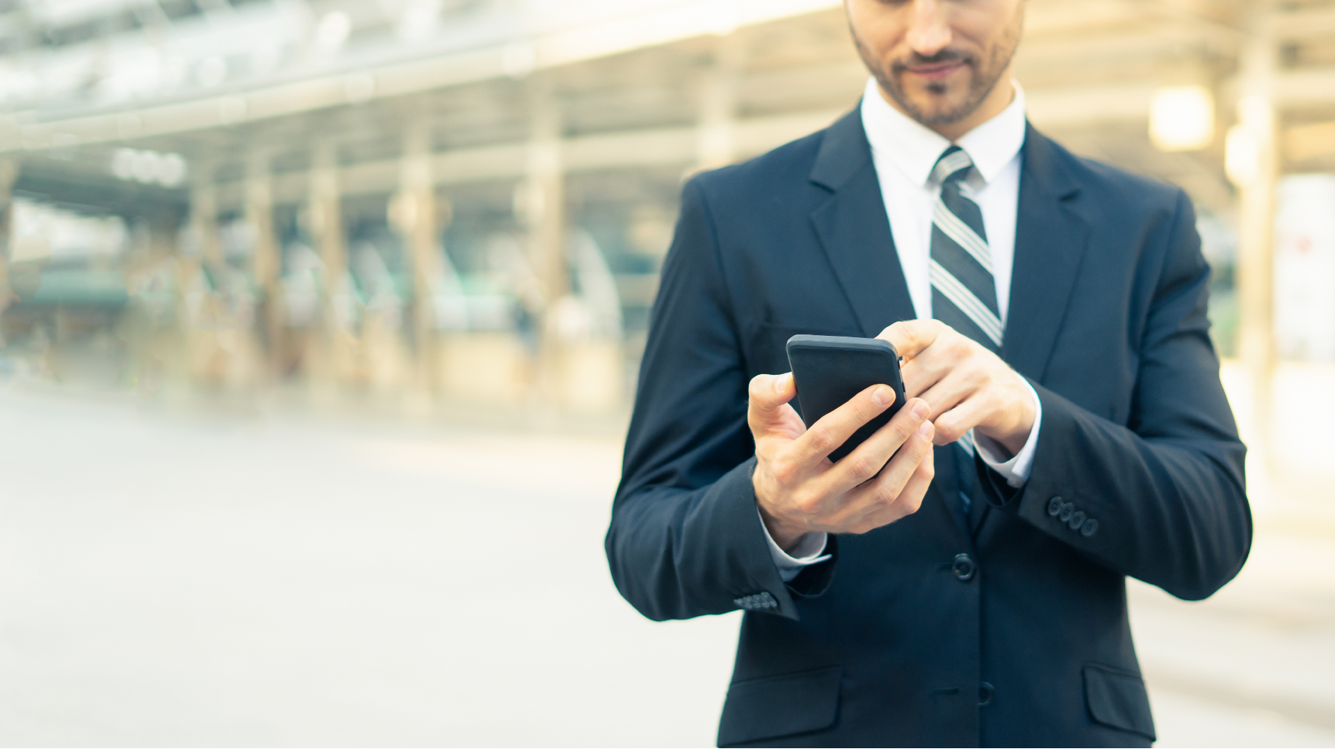 A man typing on his smartphone