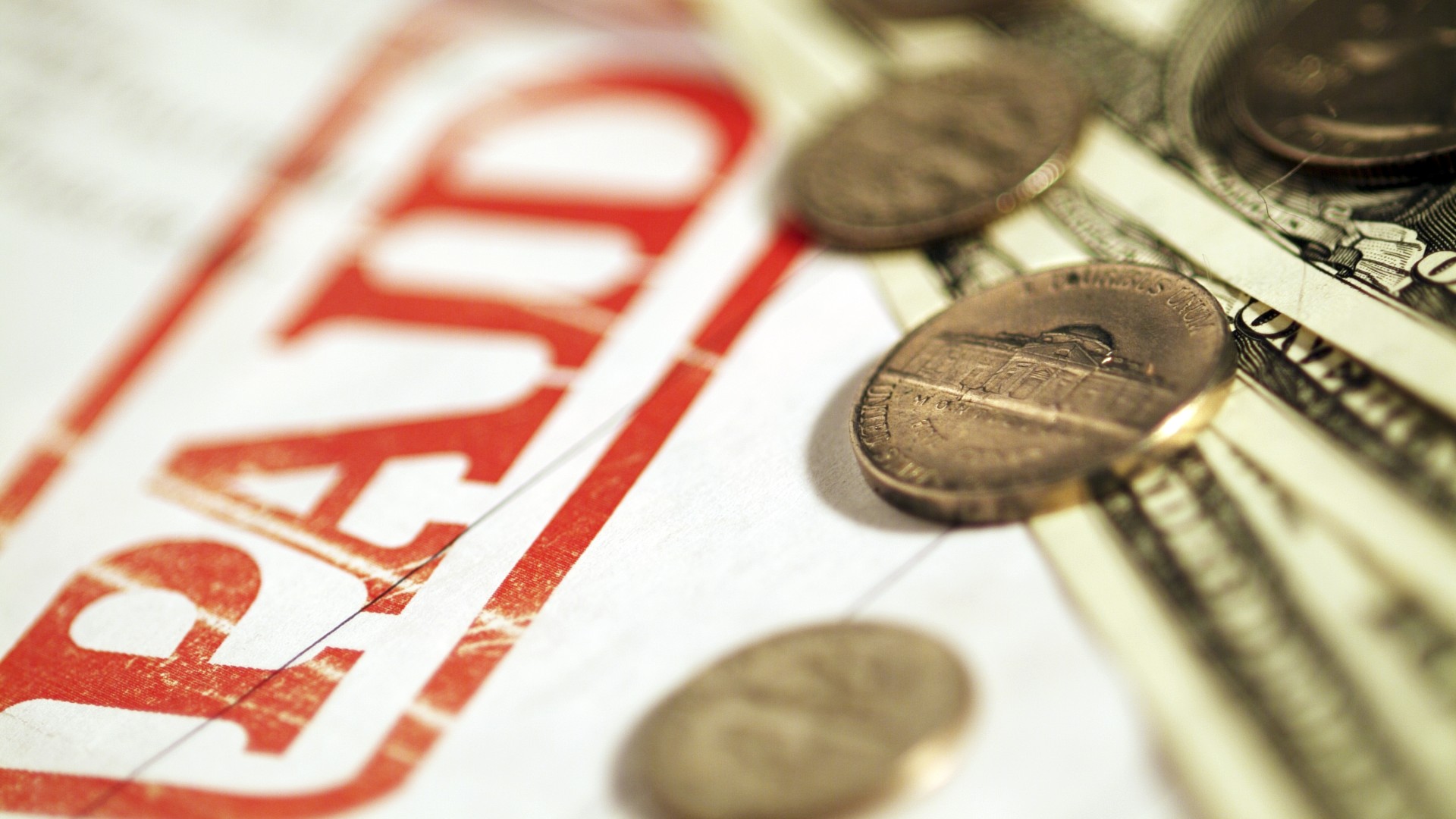 Money lays on top of a paid bill to show what credit repair can do for you?