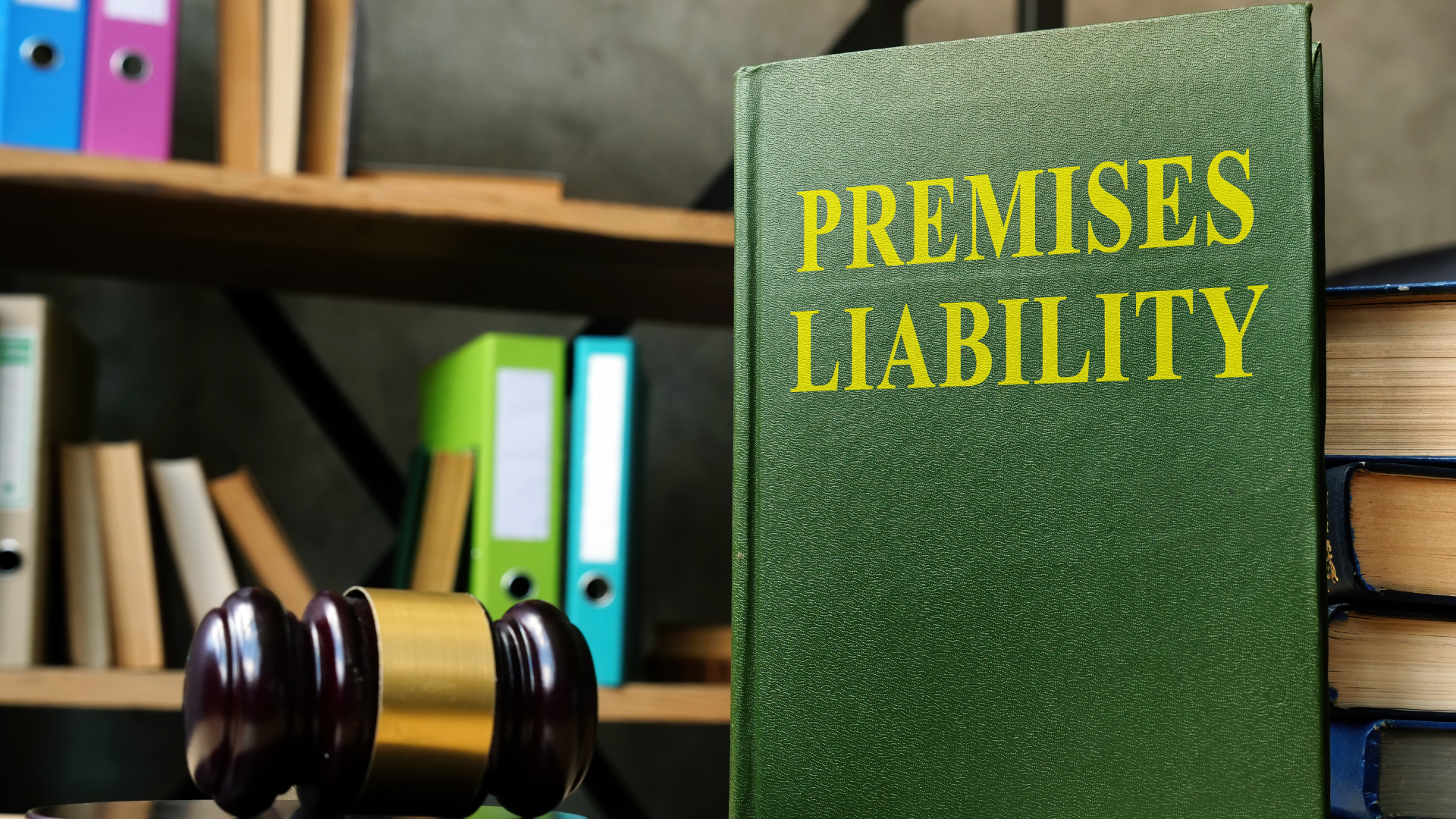 A premises liability book on display by a gavel in a library