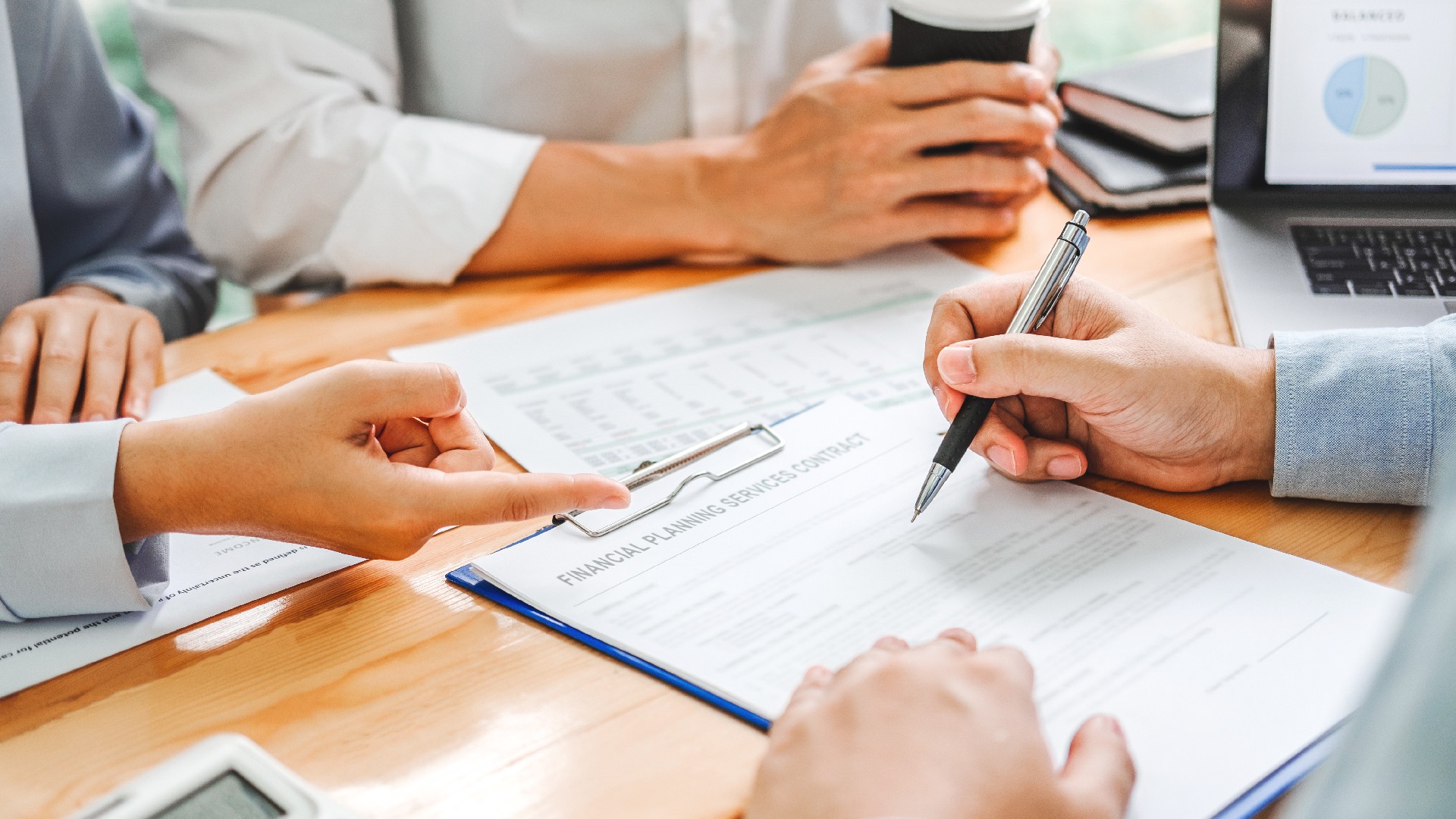 A person is reviewing credit counseling paperwork