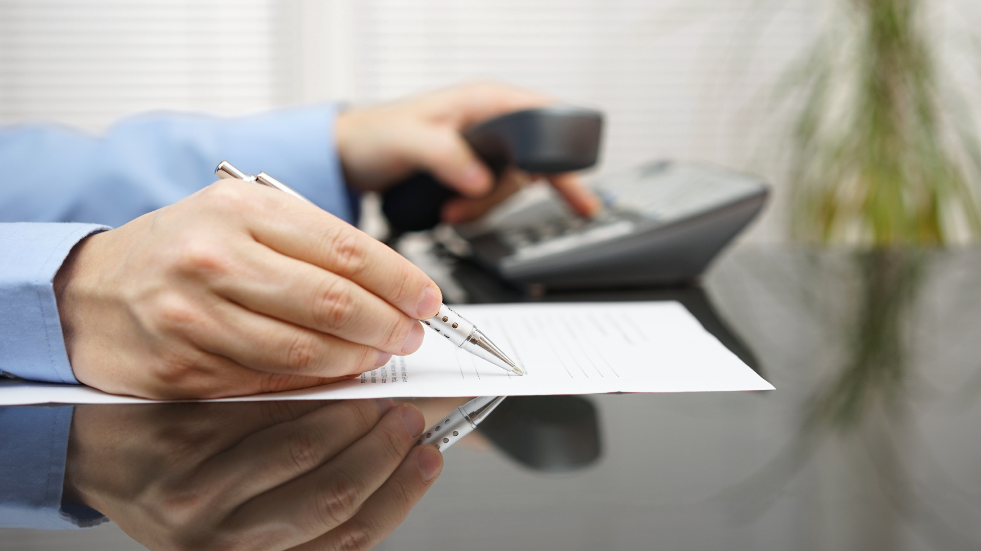 Professional signing legal documents on a desk | Texas bankruptcy lawyers