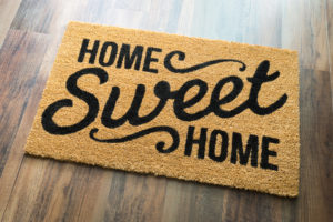 Welcome mat that says "home sweet home"