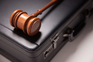 Gavel on black briefcase