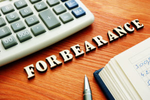 Mortgage Loan Forbearance Lawyer Texas - forbearance word from wooden letters.