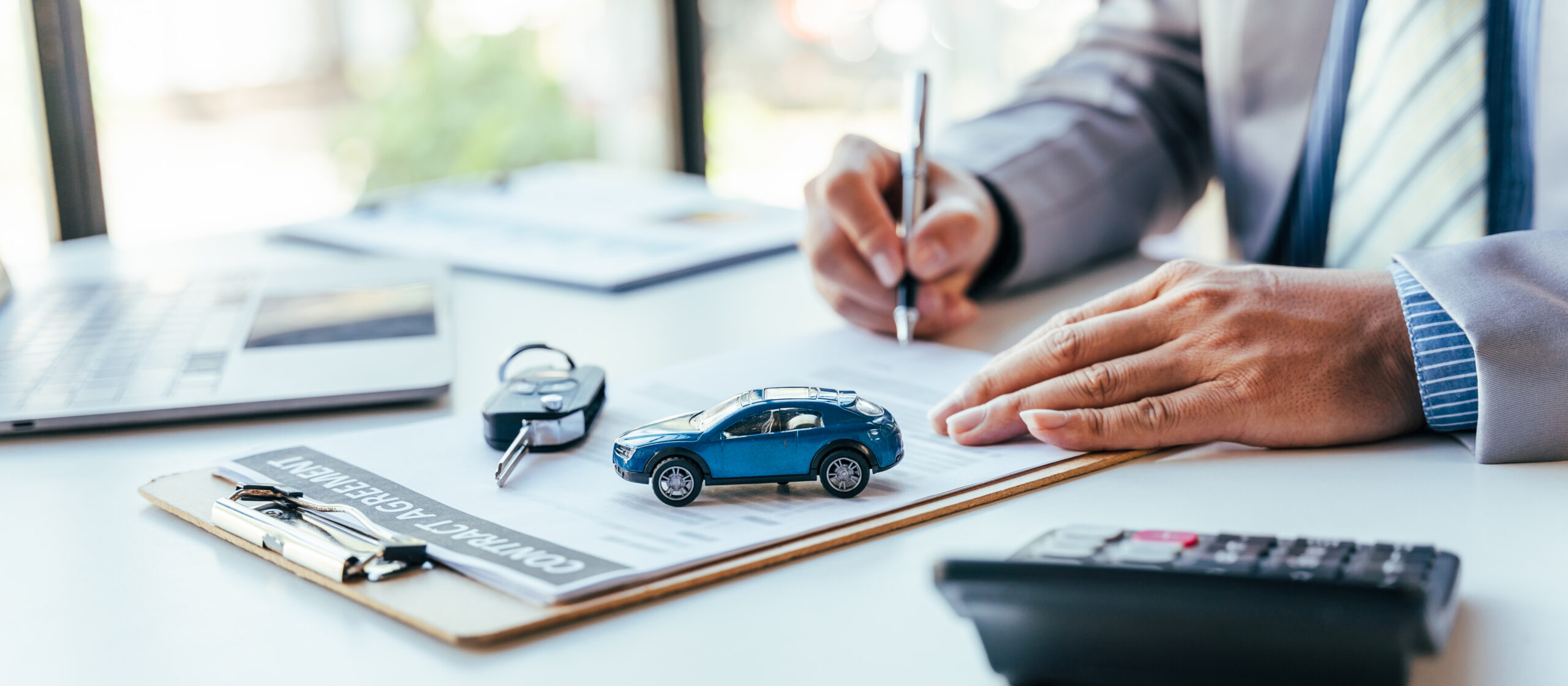 A customer signing a new car loan