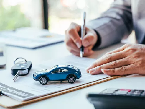 A customer signing a new car loan